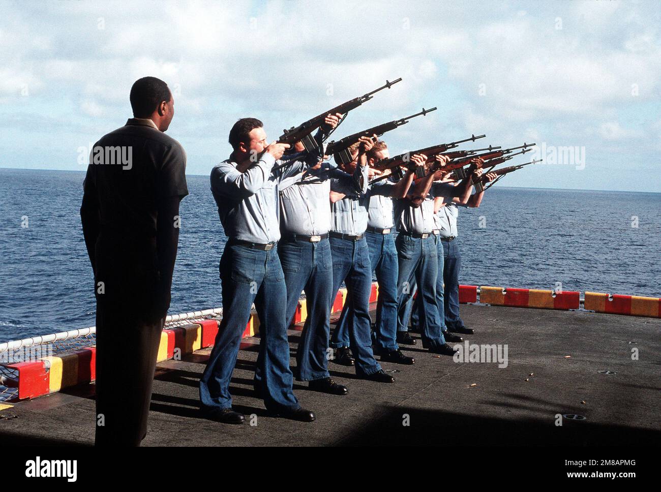 Sailors aboard the amphibious assault ship USS PELELIU (LHA 5) fire a ...