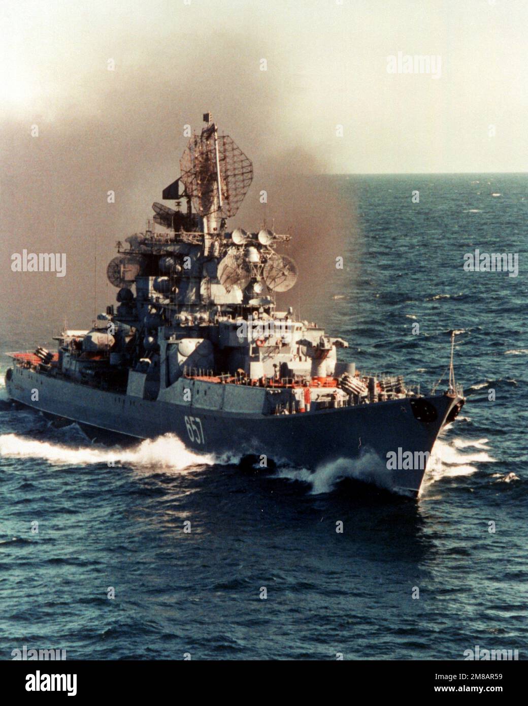 A starboard bow view of the Soviet Kresta II Class guided missile cruiser ADMIRAL YUMASHEV underway. Country: Unknown Stock Photo