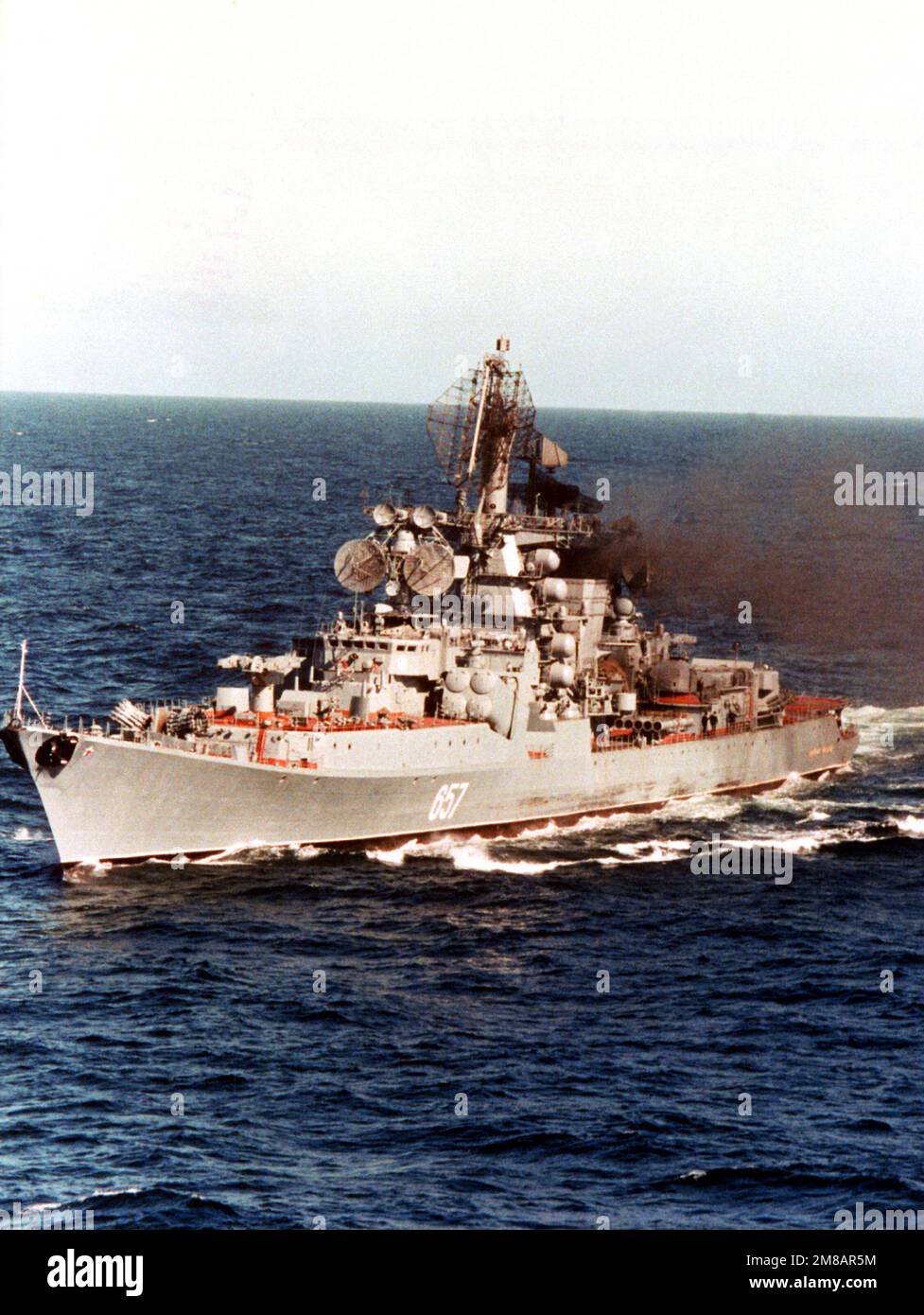 A port bow view of the Soviet Kresta II class guided missile cruiser Admiral Yumashev underway. Country: Unknown Stock Photo