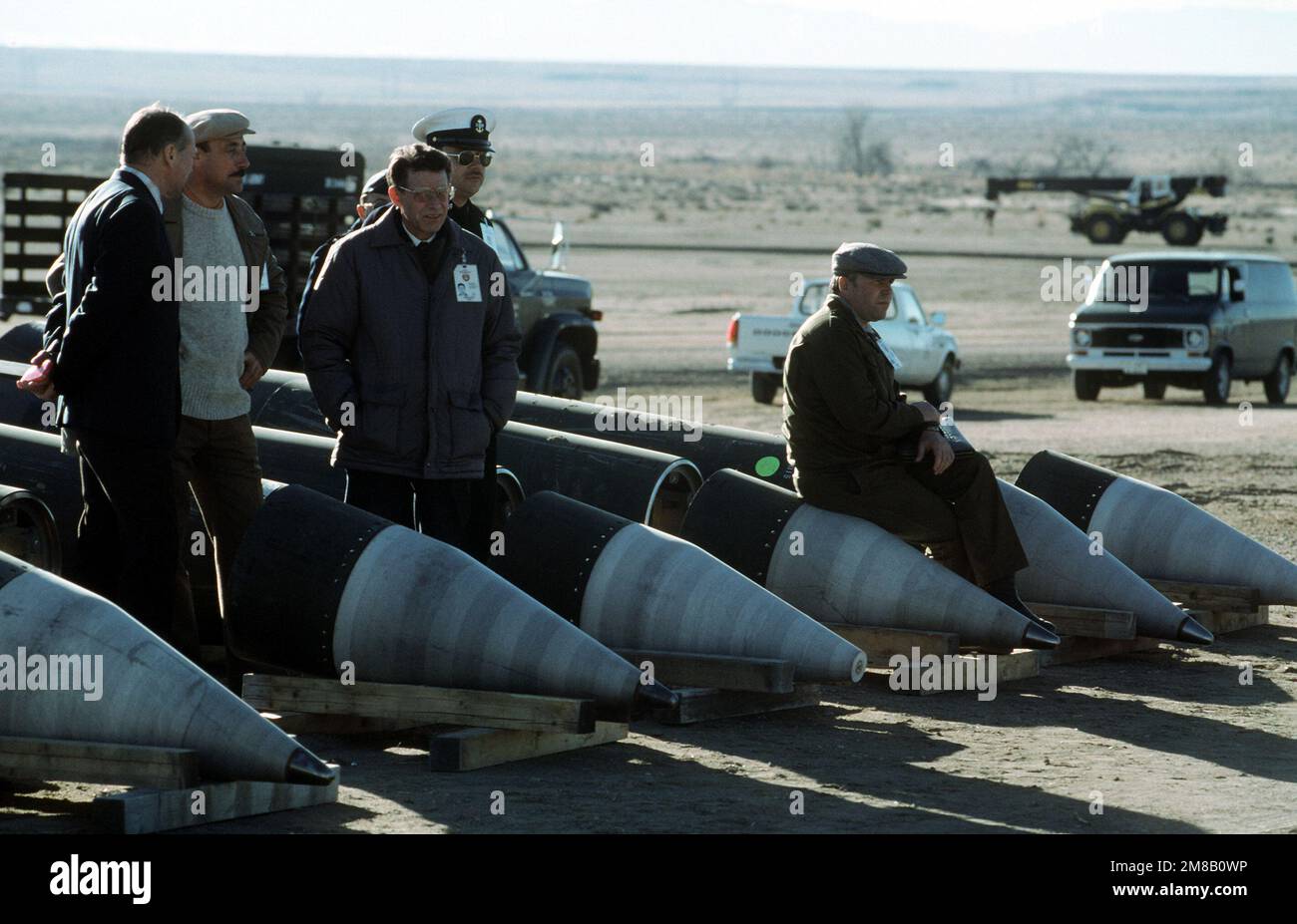 Soviet inspectors and their American escorts stand among several dismantled Pershing II missiles as they view the destruction of other missile components. The missiles are being destroyed in accordance with the Intermediate-Range Nuclear Forces (INF) Treaty. Base: Pueblo Army Depot Activity State: Colorado (CO) Country: United States Of America (USA) Stock Photo