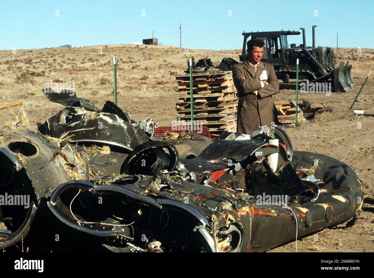 A Soviet inspector stands beside the mangled remnants of two Pershing II missile stages. Several missiles are being destroyed in the presence of Soviet inspectors in accordance with the Intermediate-Range Nuclear Forces (INF) Treaty. Base: Pueblo Army Depot Activity State: Colorado (CO) Country: United States Of America (USA) Stock Photo