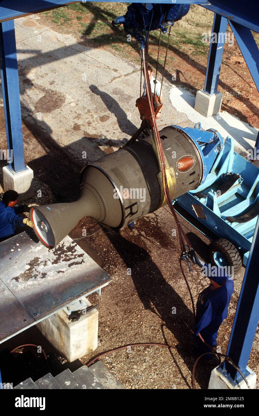 A propulsion stage from a Pershing 1A missile is lowered into place on a firing stand. Several missiles are being destroyed in the presence of Soviet inspectors in accordance with the Intermediate-Range Nuclear Forces (INF) Treaty. Base: Longhorn Army Ammunition Plant State: Texas (TX) Country: United States Of America (USA) Stock Photo