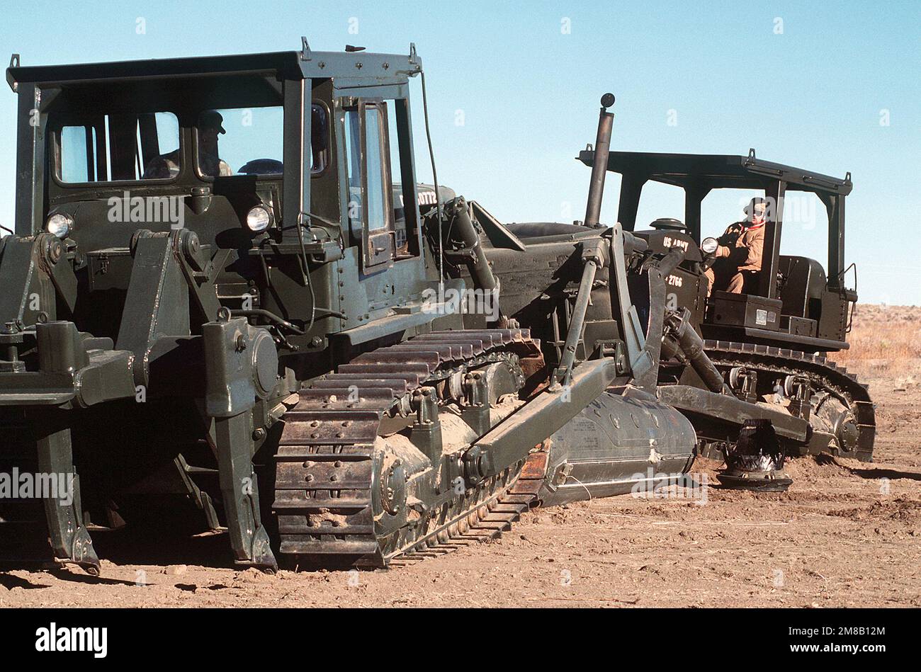 Two Army D-7 bulldozers are driven onto a section of a Pershing II missile. Several missiles are being destroyed in the presence of Soviet inspectors in accordance with the Intermediate-Range Nuclear Forces (INF) Treaty. Base: Pueblo Army Depot Activity State: Colorado (CO) Country: United States Of America (USA) Stock Photo