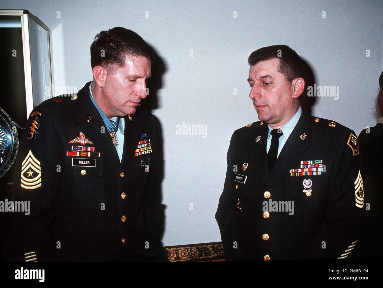 Medal of Honor recipients SGT. MAJ. Miller and SGT. MAJ. Robert C. Murray converse during the Medal of Honor breakfast being held in conjunction with inaugural functions for George H.W. Bush, 41st president of the United States. Base: Washington State: District Of Columbia (DC) Country: United States Of America (USA) Stock Photo