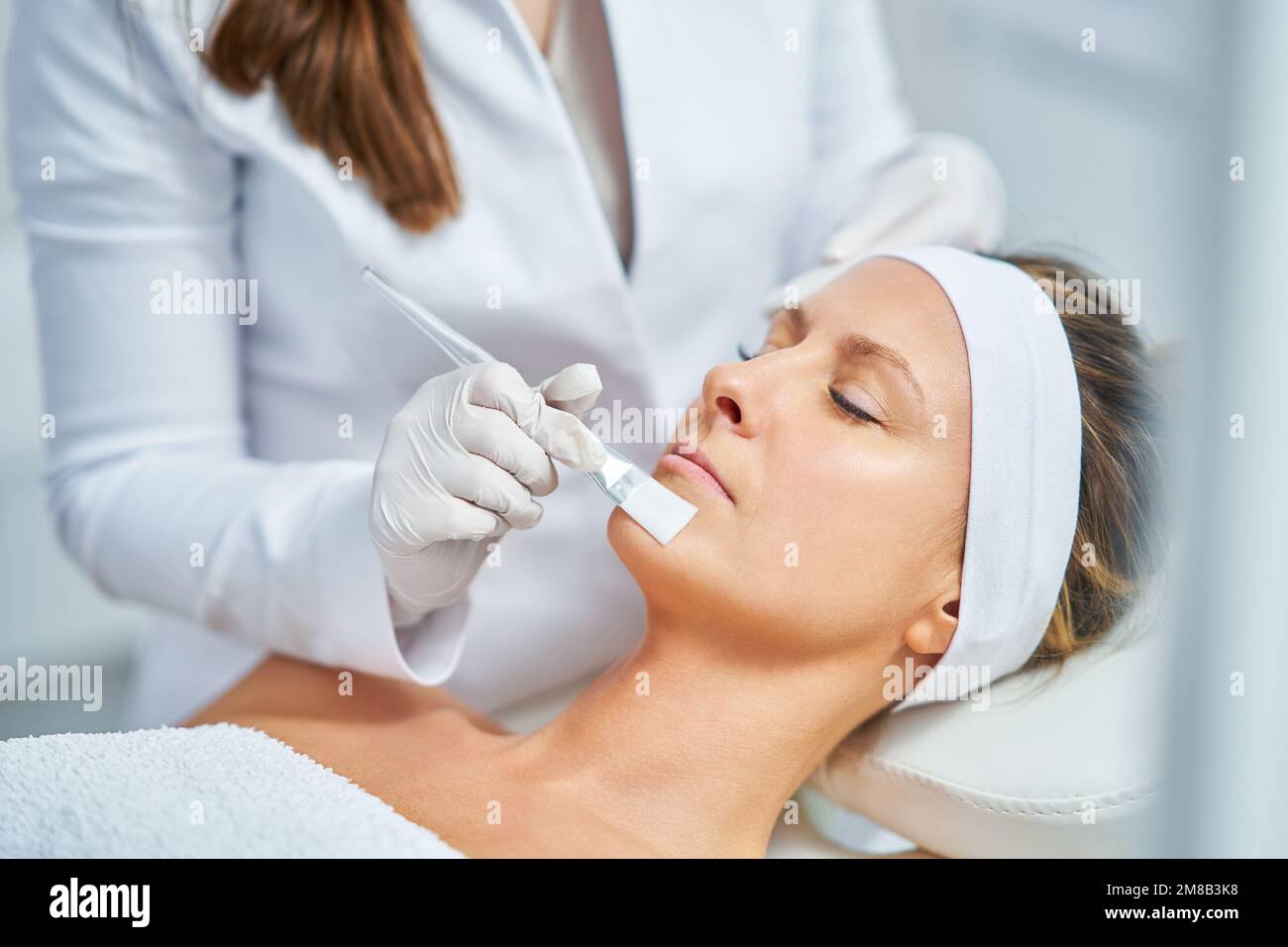 Woman peeling skin face hi-res stock photography and images - Alamy