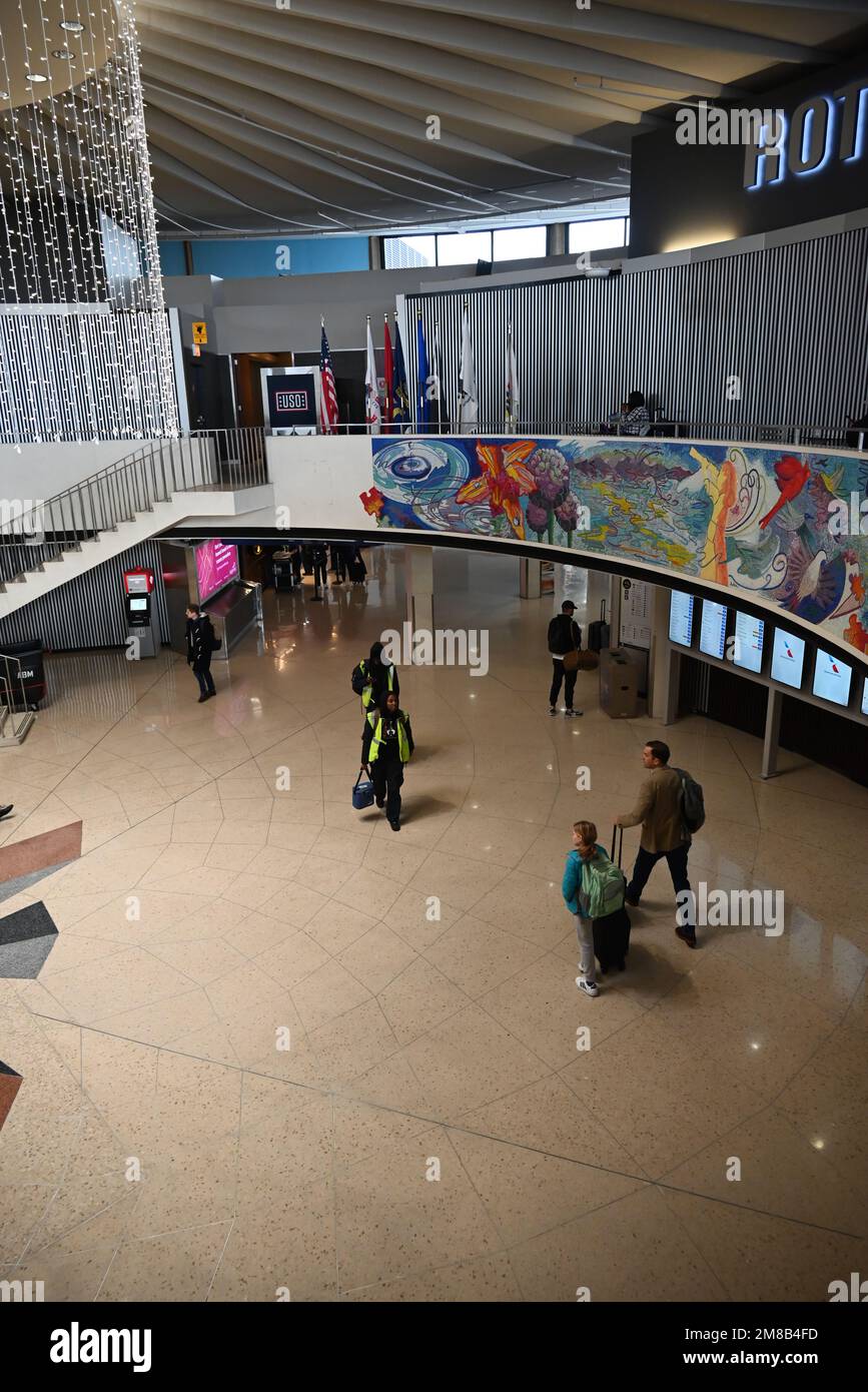 Travelers pass through O'Hare Airport's Rotunda Building as they