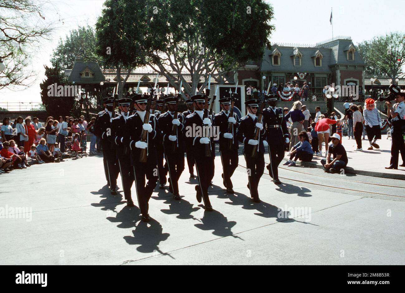 Members of the U.S. Air Force Honor Guard carry M-1 .30-caliber rifles as they perform at Disneyland during a salute in memory of the crew of the space shuttle Challenger. All seven members of the Challenger crew were killed in an explosion minutes after lift off on January 28, 1986. Base: Anaheim State: California (CA) Country: United States Of America (USA) Stock Photo