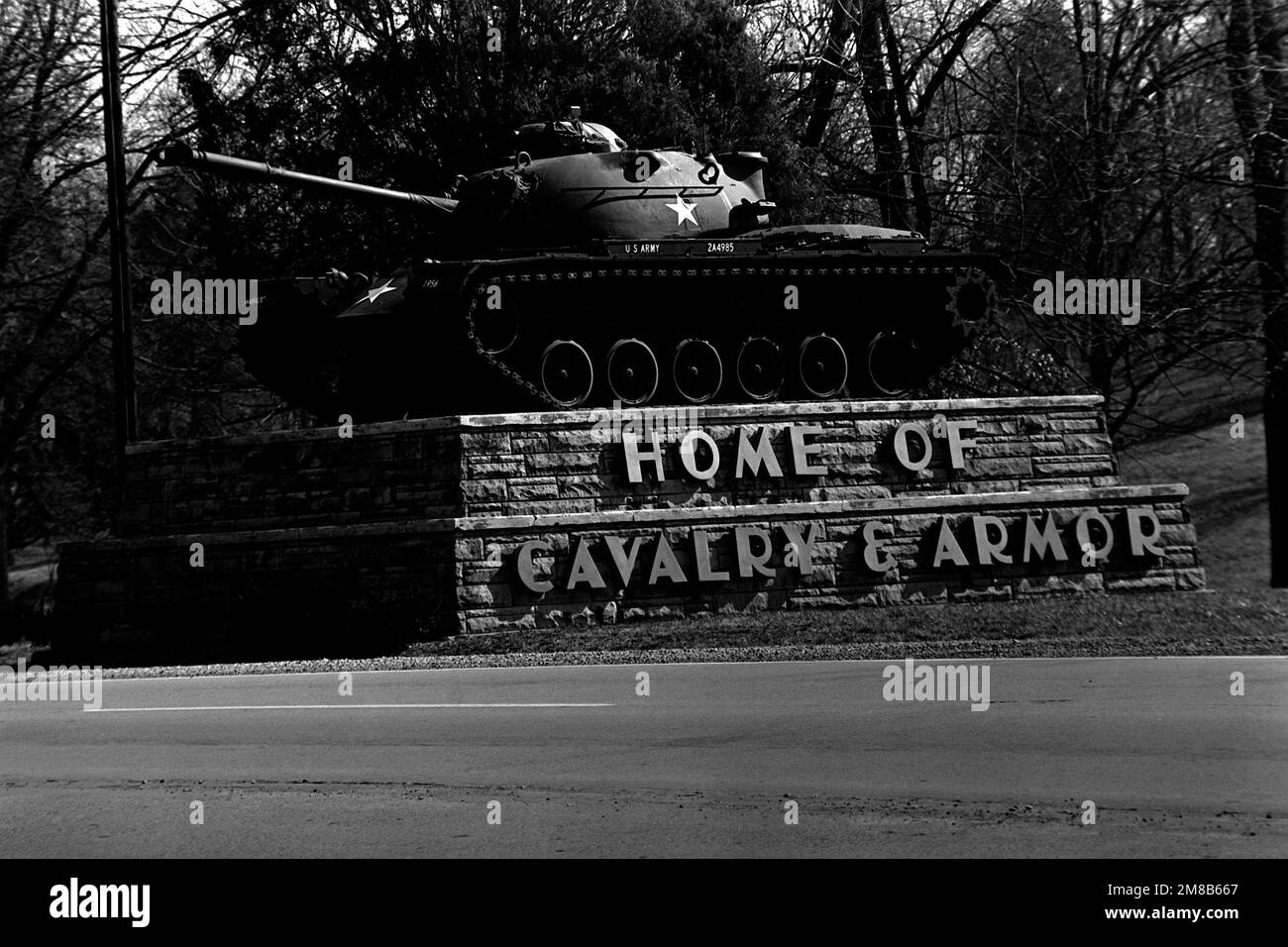 An M48 main battle tank stands at the entrance to the United States Army Armor Center. Base