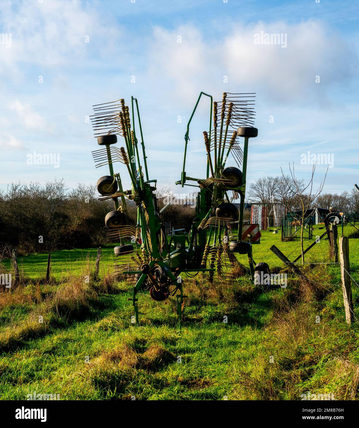 Hay rake or tedder machine to move hay for faster drying Stock Photo