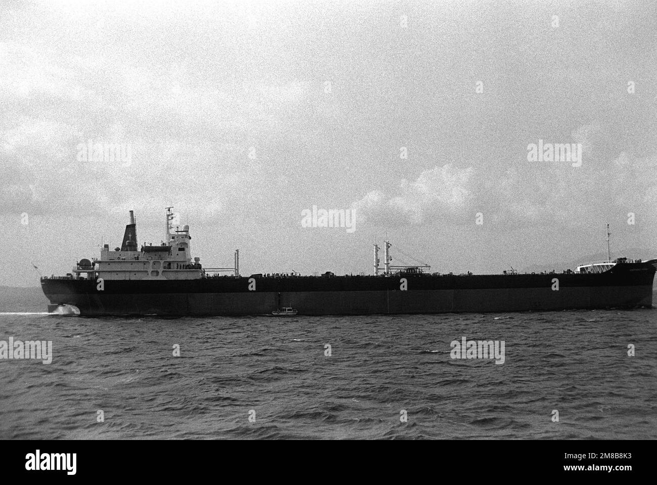 a-launch-is-dwarfed-alongside-the-petroleum-tanker-overseas-vivian-t