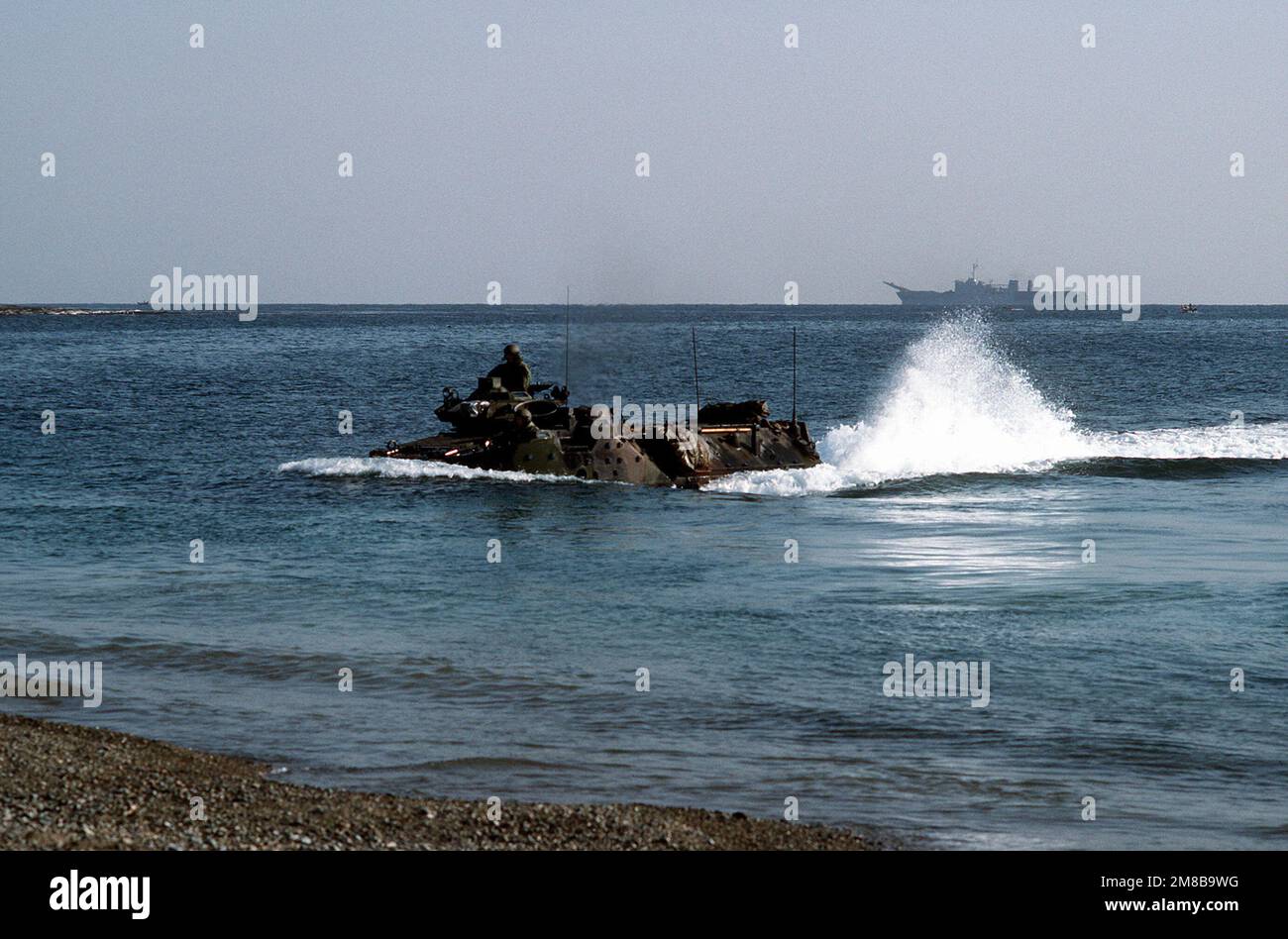 An AAV-7A1 amphibious assault vehicle comes ashore at Tok Sok Ri during Team Spirit '89. Country: South Korea Stock Photo