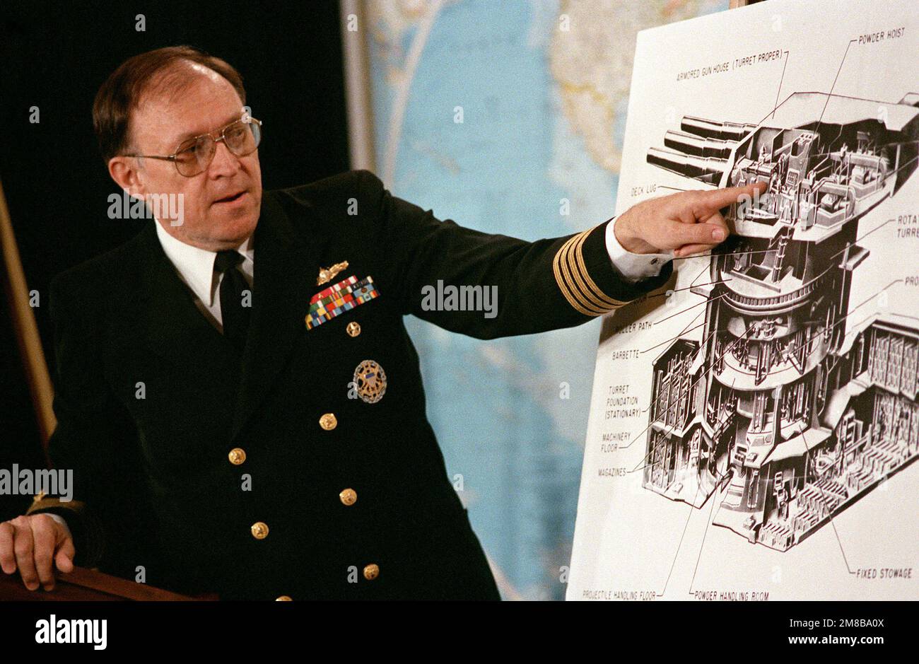 Using a diagram of a 16inch gun turret, Captain Larry Seaquist briefs