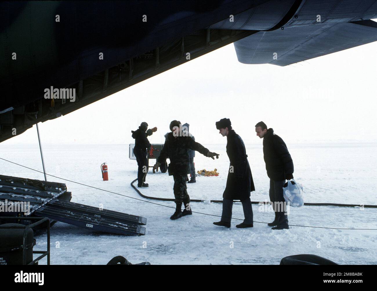 Accompanied by an Alaska Air National Guardsman, Soviet defectors ...