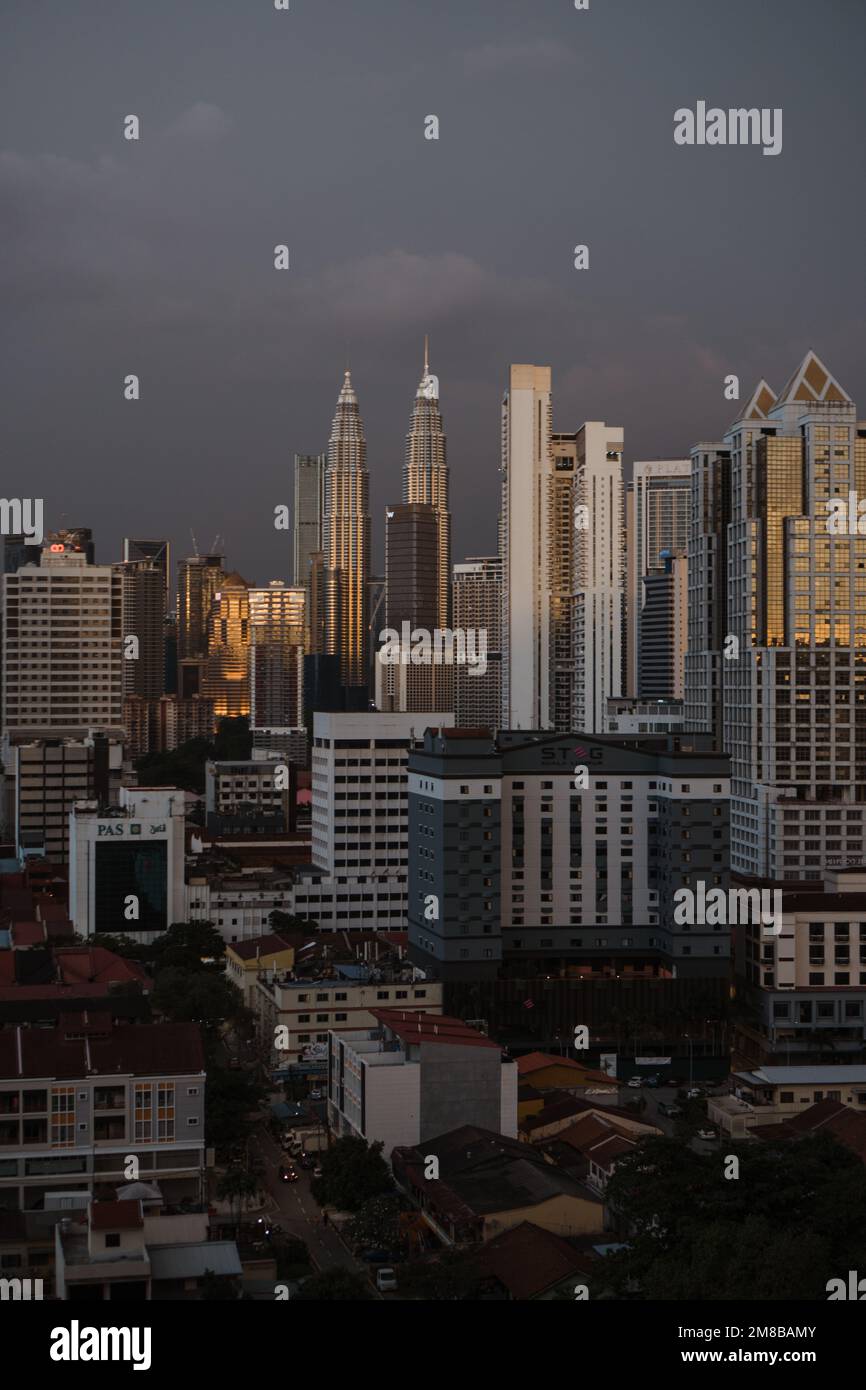A vertical shot of modern buildings in the city center of Kuala Lumpur ...