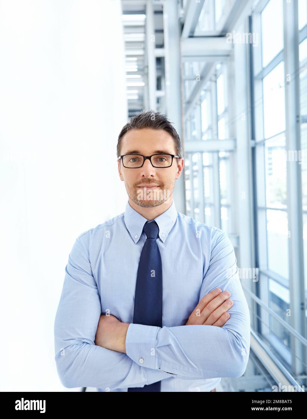 Portrait, leader and businessman in office building proud, mindset and ambitious, attitude and tough. Face, ceo and leadership by assertive male Stock Photo