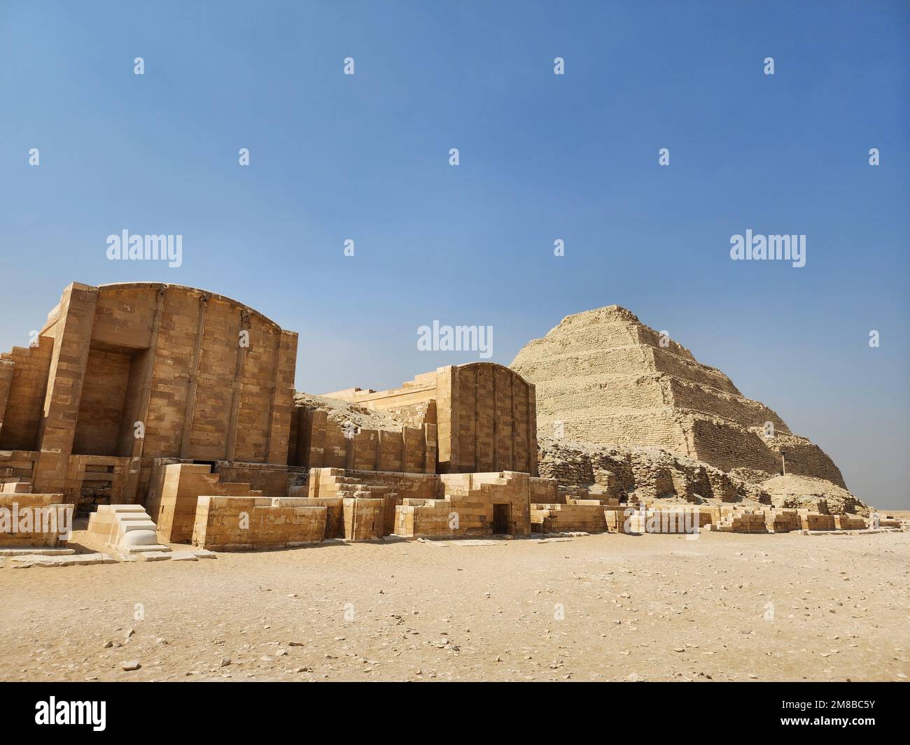 The step pyramids at Saqqara Necropolis in Egypt against the clear blue ...
