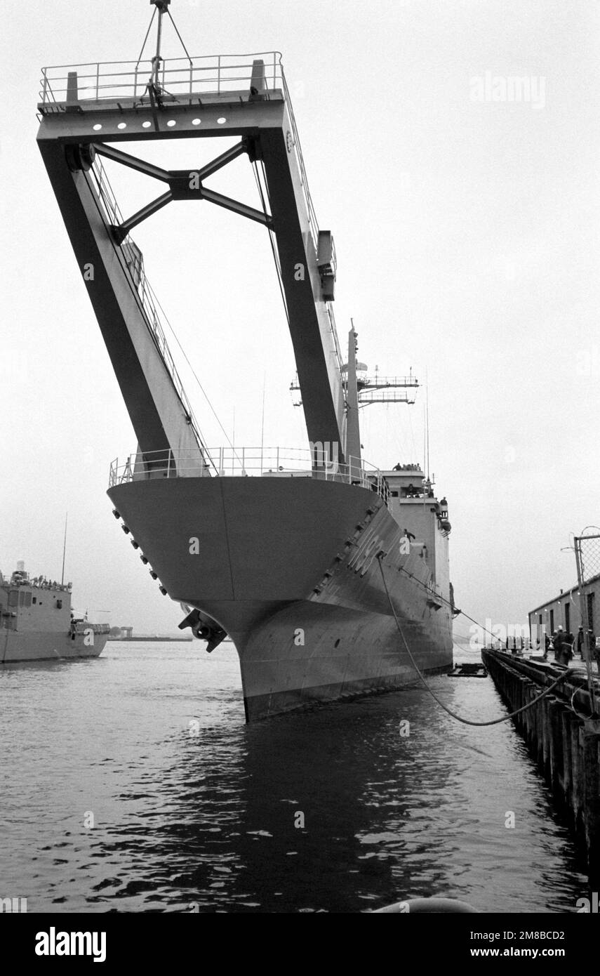 The tank landing ship USS FAIRFAX COUNTY (LST 1193) ties up to a pier