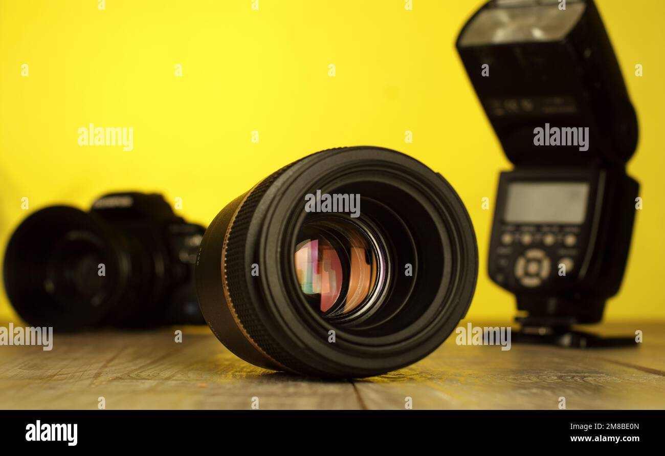 macro lens on a table with photographic equipment in the background Stock Photo