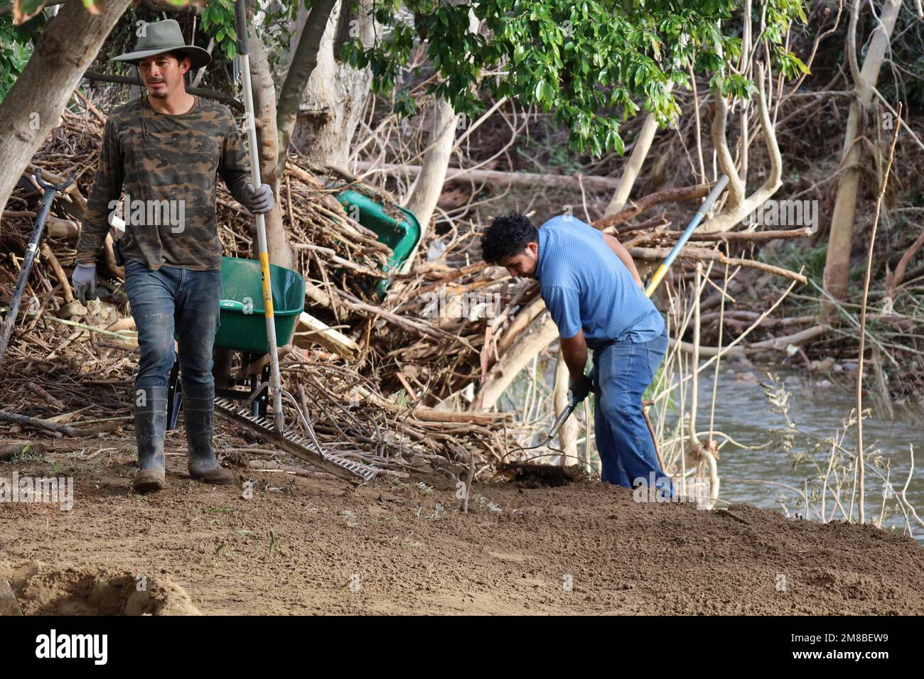 Santa Barbara, California, U.S.A. 12th Jan, 2023. Cleaners with rake