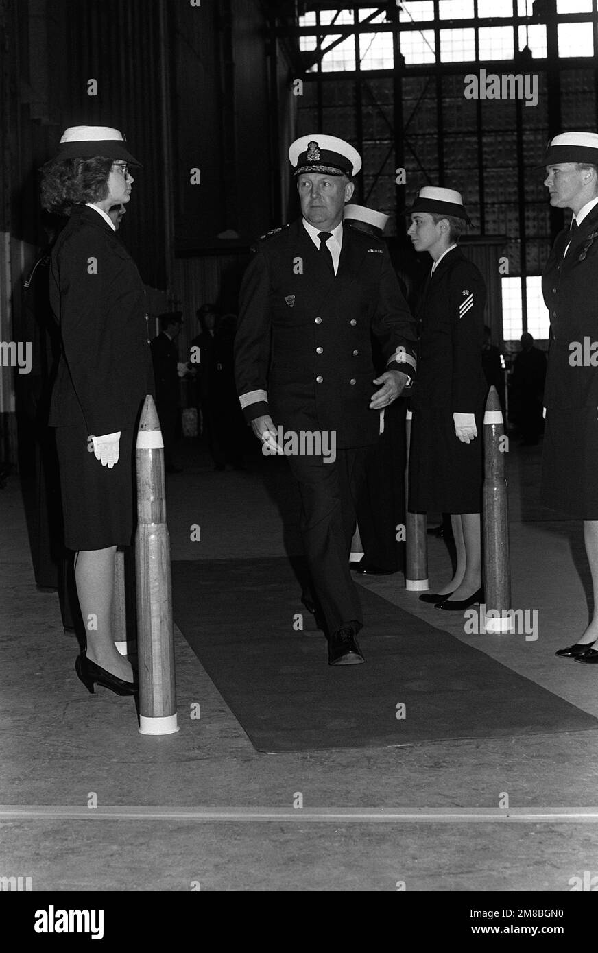 An unidentified Canadian flag officer passes through an honor guard during the IDF change of command ceremony. Base: Naval Air Station, Keflavik Country: Iceland (ISL) Stock Photo