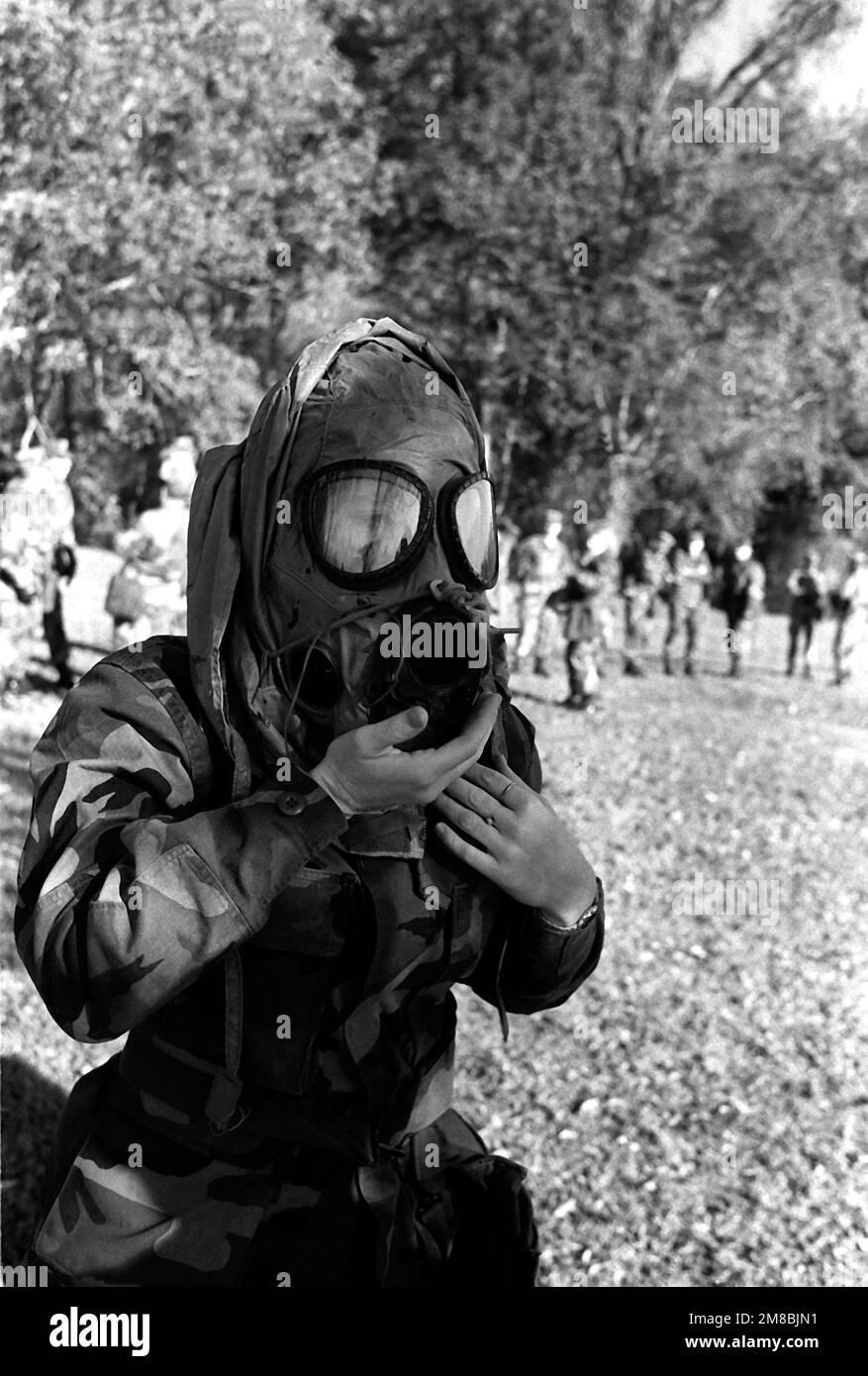 A 4th Marine Division reservist clears her M-17A1 biological-chemical protective mask before a gas chamber exercise. Country: Unknown Stock Photo