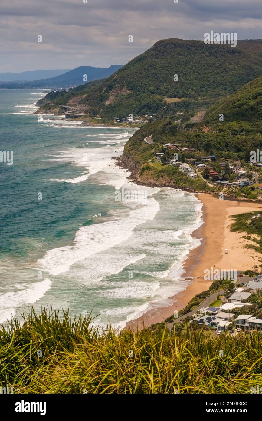 Stanwell Park Beach in New South Wales, Australia with the Sea Cliff bridge in the distance Stock Photo