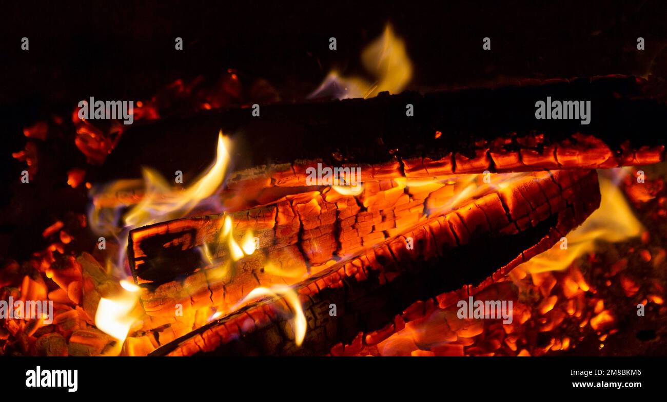 Wood burning close up. Embers charred in a flame of fire Stock Photo ...
