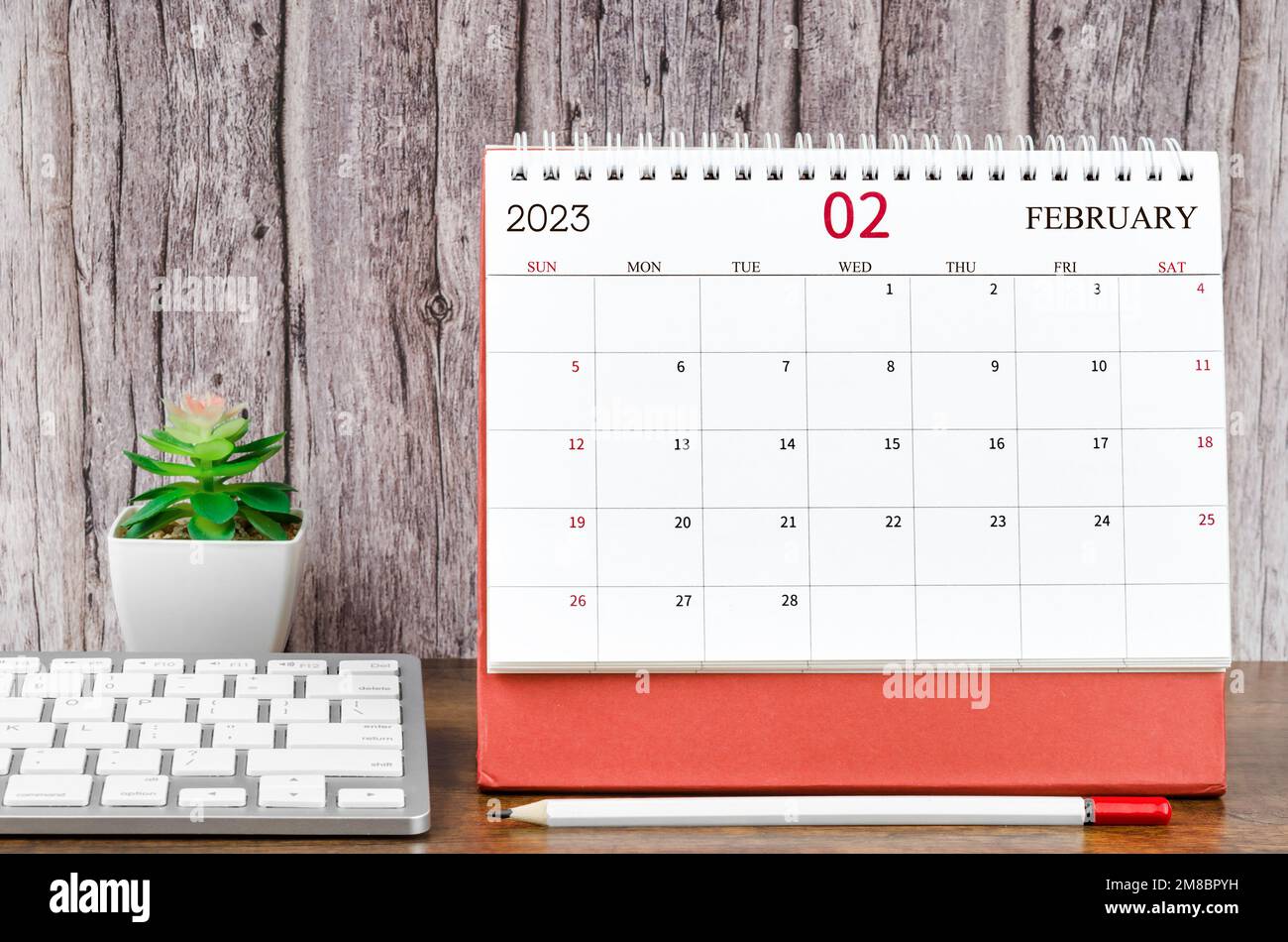 February 2023 Monthly desk calendar for 2023 year with the computer ...