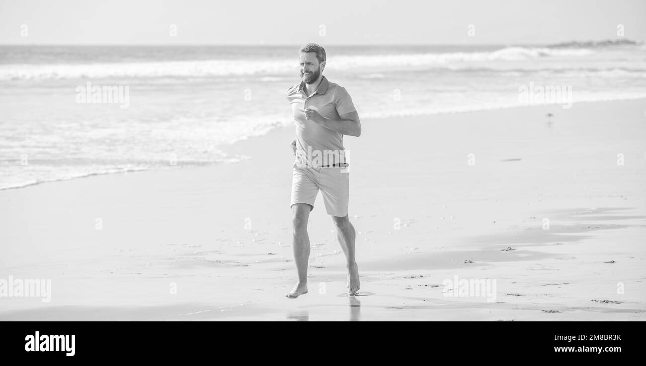 Morning workout activity healthy man running on beach energetic