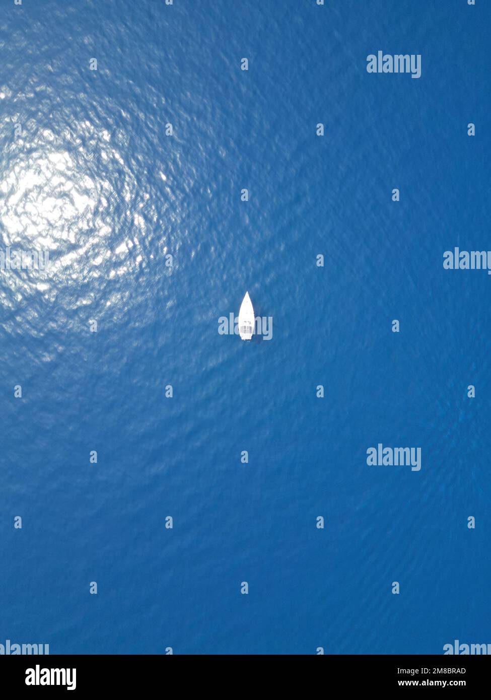 A top view of a boat sailing in the blue lake Stock Photo - Alamy