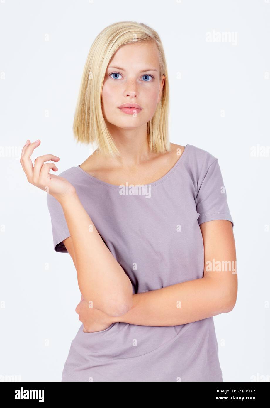 Woman, portrait or attitude pose on studio background in assertive