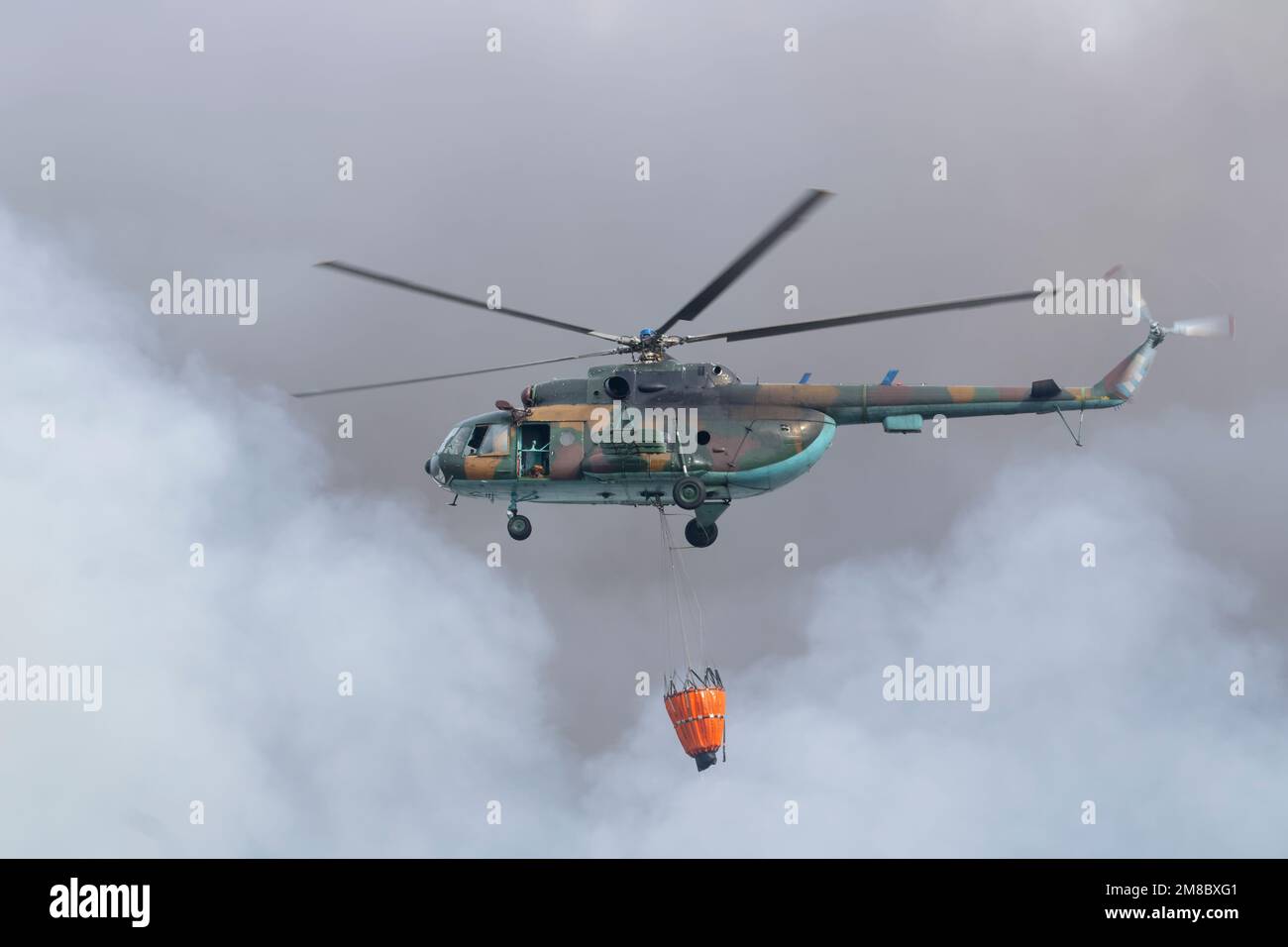 Cuban armed forces helicopter putting out the fire from the explosion