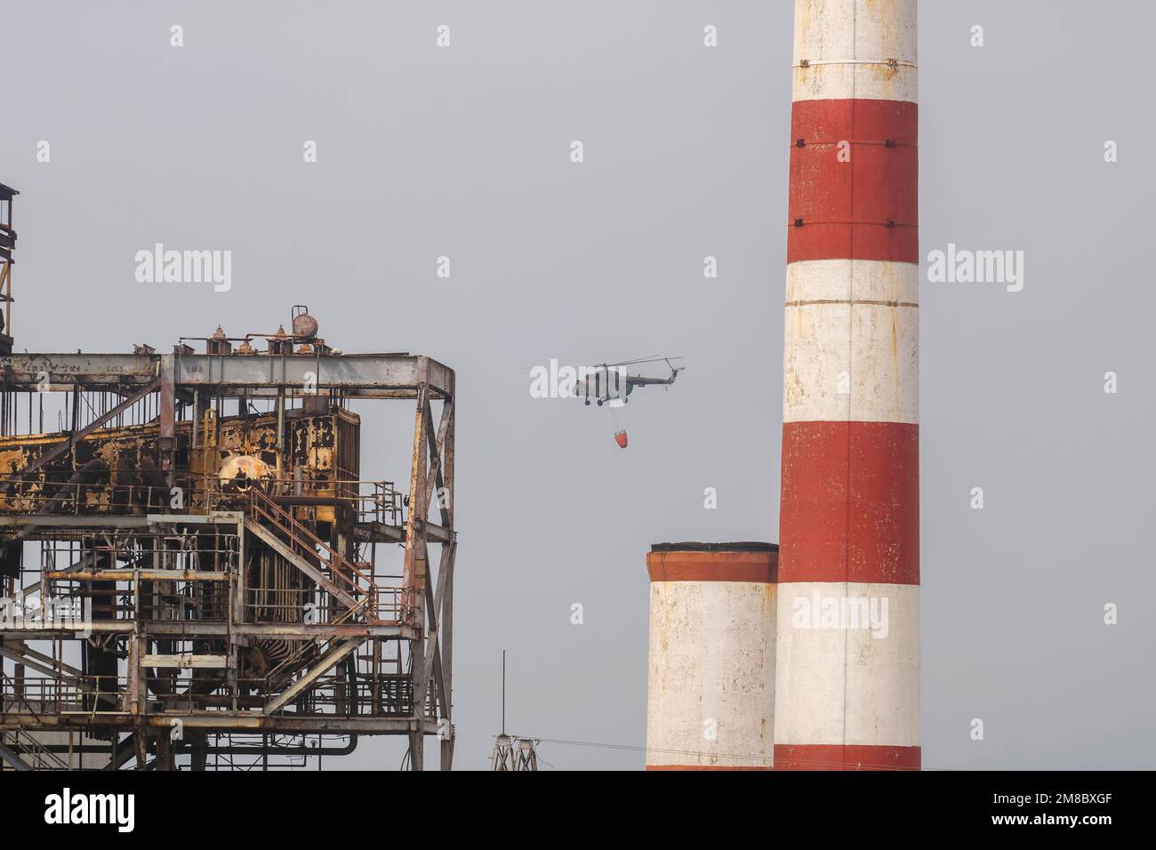 Cuban armed forces helicopter putting out the fire from the explosion