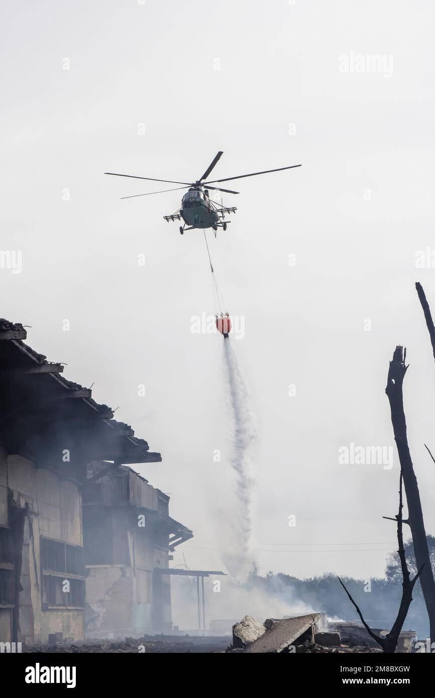 Cuban armed forces helicopter putting out the fire from the explosion