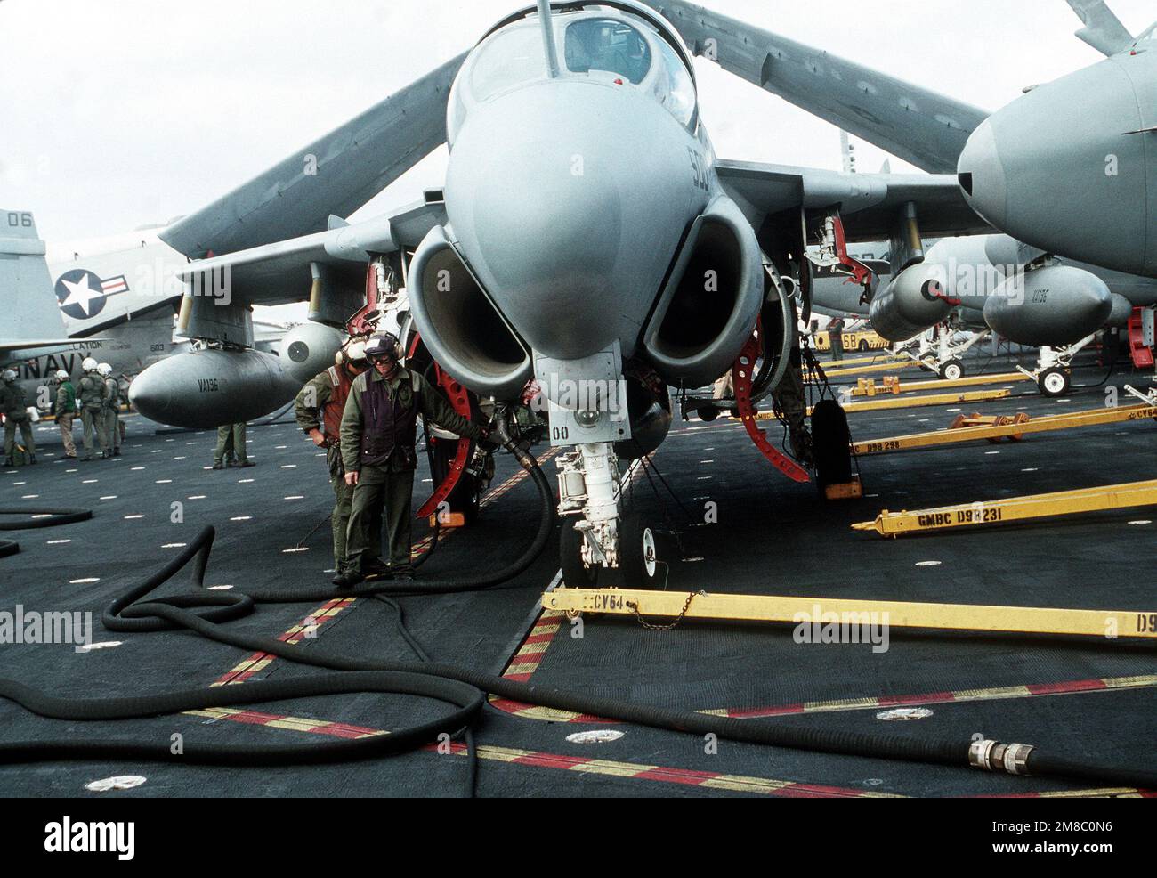 An aviation fuels crew member refuels an Attack Squadron 196 (VA196) A6E Intruder aircraft