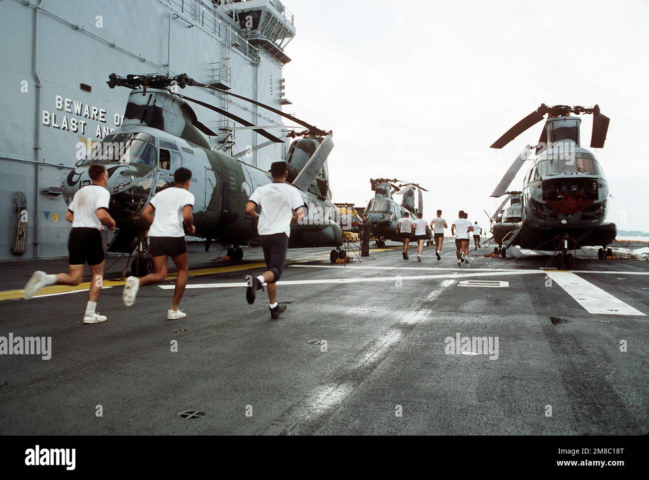 Sailors aboard the amphibious assault ship USS TARAWA (LHA1) take