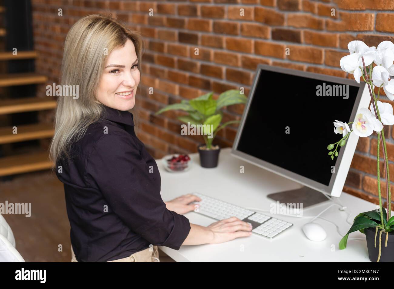 Searching for new solution. a woman with a computer Stock Photo - Alamy