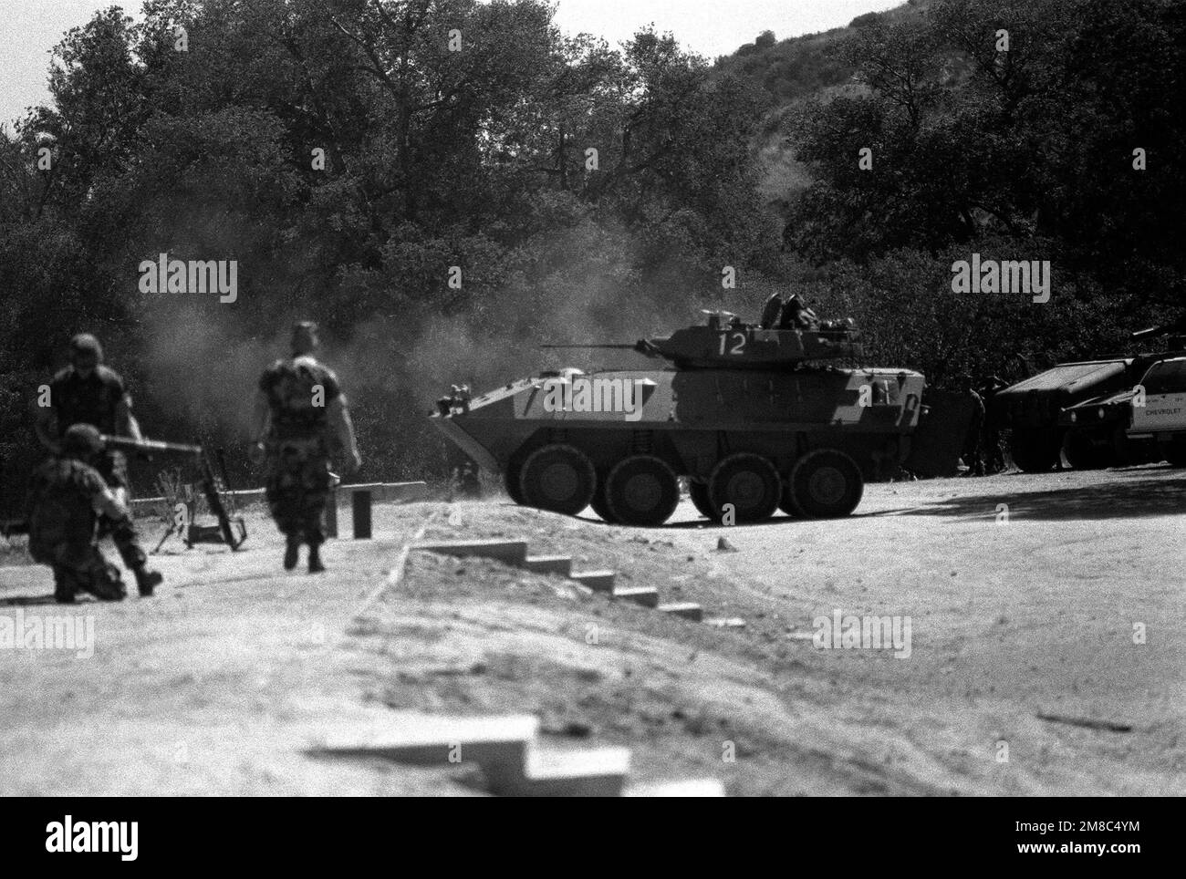 A Marine Corps LAV-25 light armored vehicle moves up to the firing line