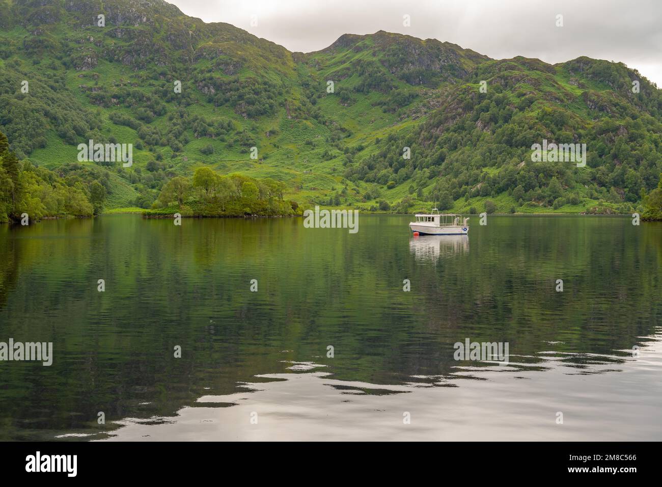 Boat moored on Loch Katrine in the Trossachs, Part of Loch Lomond and