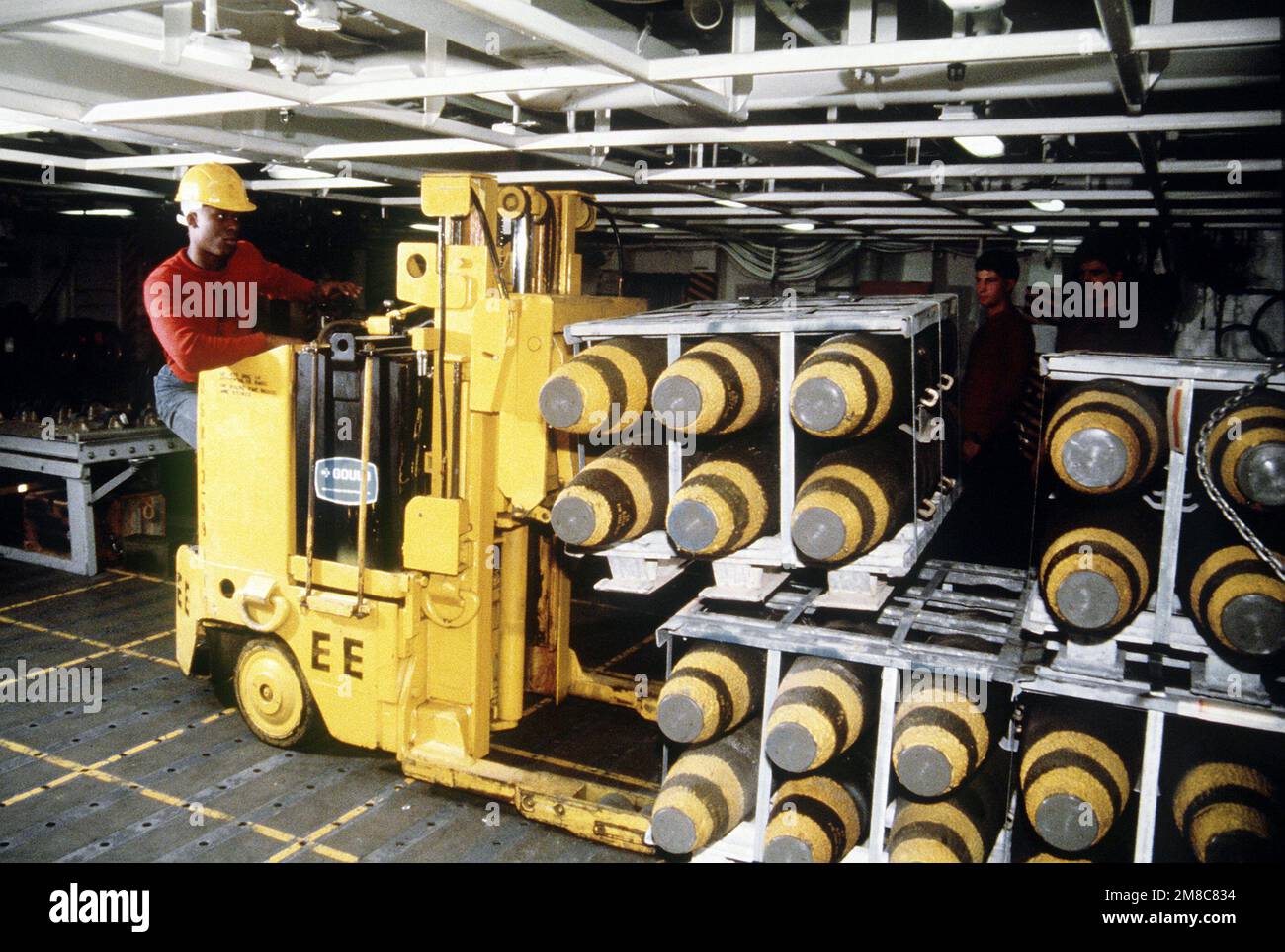 An aviation ornanceman uses a forklift to move Mark 82 500lb. bombs aboard the nuclearpowered