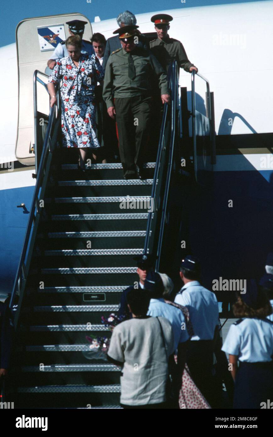 Soviet Defense Minister General Dmitriy T. Yazov and his wife, Emma, lead their delegation down the steps of an aircraft after arriving for a goodwill visit. Base: Luke Air Force Base State: Arizona (AZ) Country: United States Of America (USA) Stock Photo