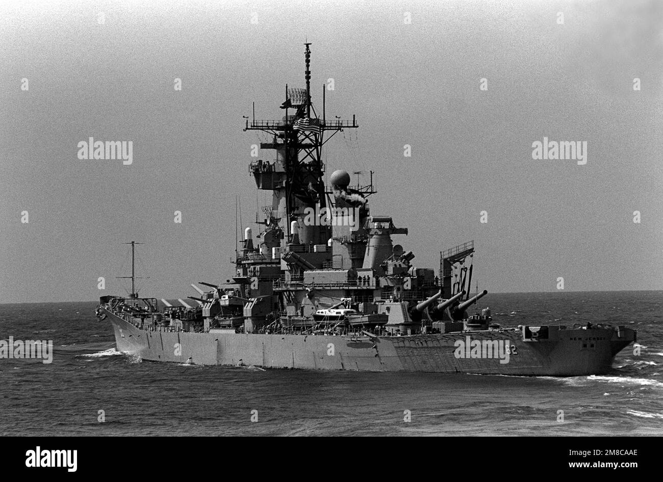 A port quarter view of the battleship USS NEW JERSEY (BB-62) underway ...