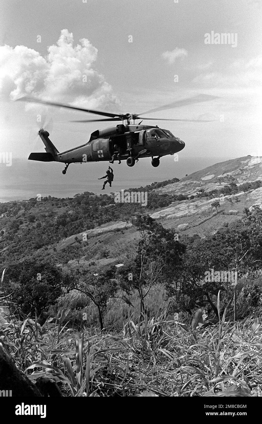 A UH60 Black Hawk helicopter hovers near the position of Company D