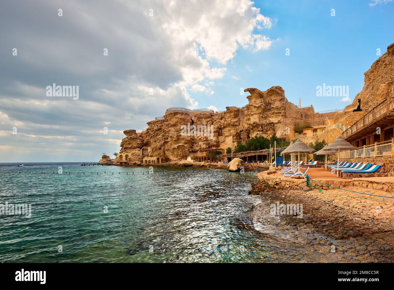 A beach at mid-day with mountain at the horizon - Sharm el-Sheikh, Egypt Stock Photo