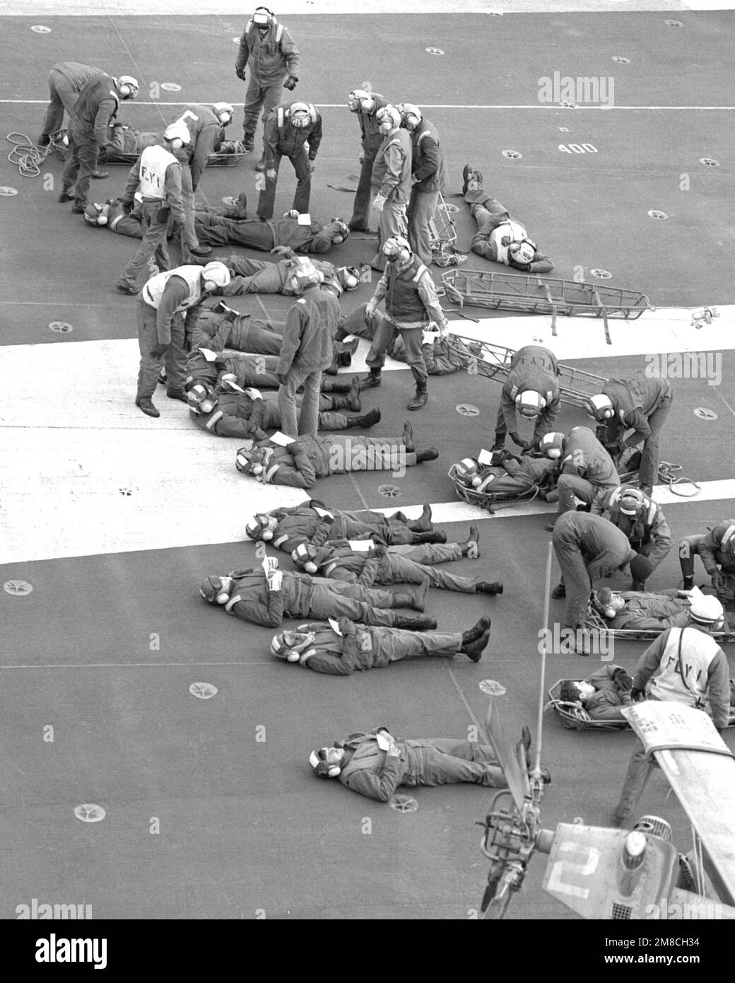 Crew members aboard the nuclear-powered aircraft carrier USS ABRAHAM LINCOLN (CVN-72) conduct a mass casualty drill. Country: Atlantic Ocean (AOC) Stock Photo