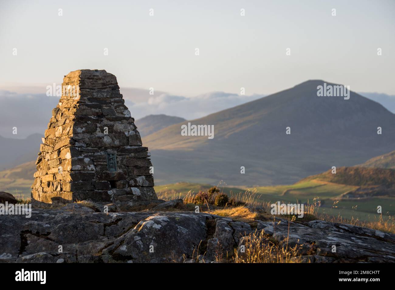 A view across to Moel Hebog mountain from Moel y Gest summit cairn, Porthmadog, North Wales, UK Stock Photo