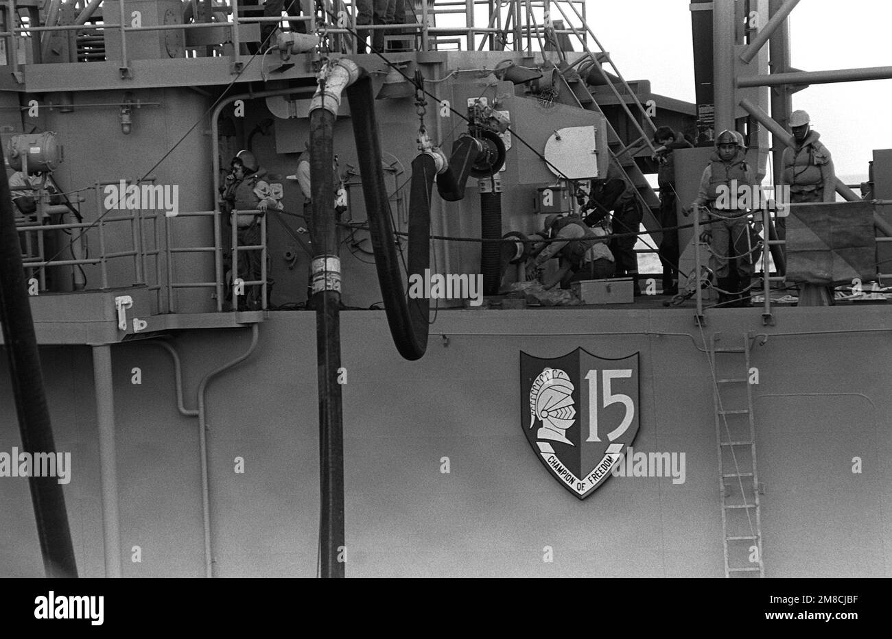 Members of the underway replenishment detail stand at their stations