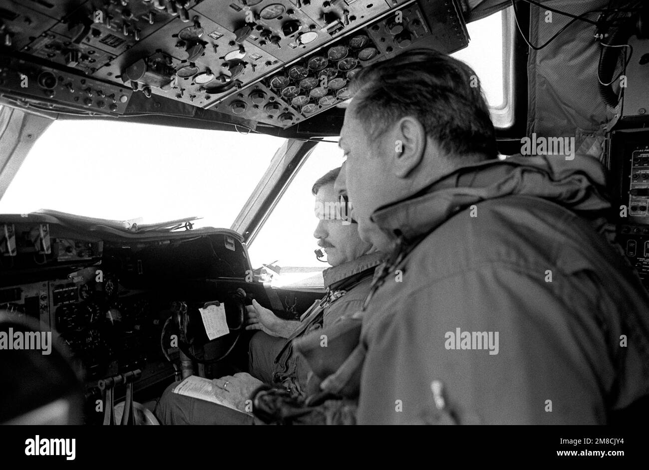 The pilot and co-pilot of a P-3 Orion aircraft of Naval Air Reserve Patrol Squadron 64 (VP-64) monitor their instrument panel during active duty training. State: Hawaii (HI) Country: United States Of America (USA) Stock Photo