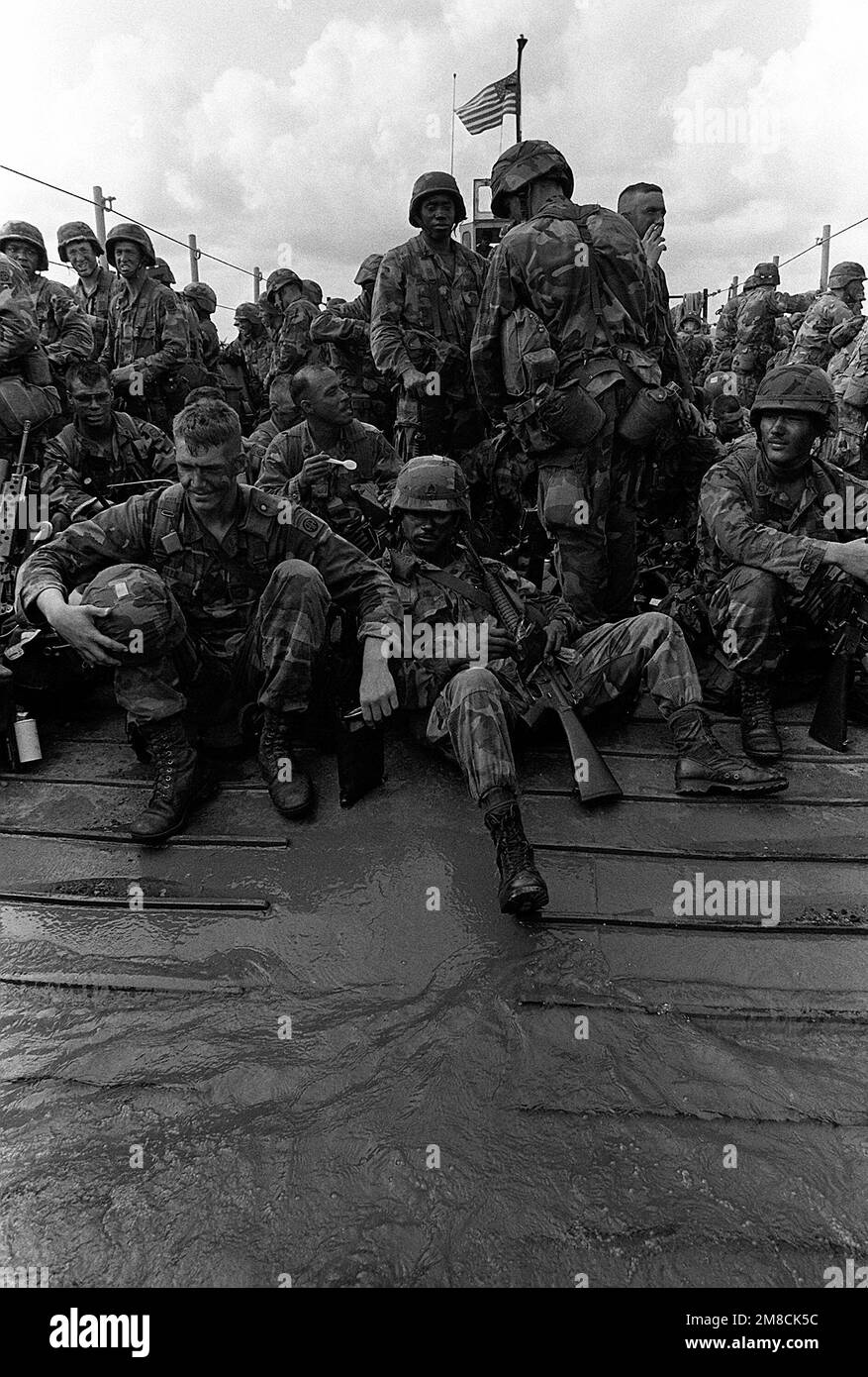 Soldiers of the 82nd Airborne Division cross Gatun Lake aboard an