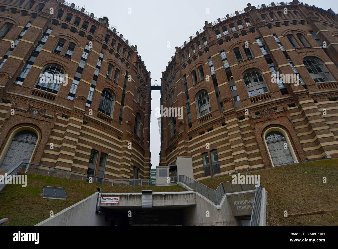 Gasometers of the former gasworks in Guglgasse, Vienna, now coverted in housing,shops & concert hall. A location in James Bond Living Daylights film Stock Photo